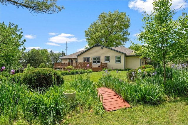 2106 Kasold Dr, Lawrence, KS 66047 - rear view of property with a lawn and a wooden deck
