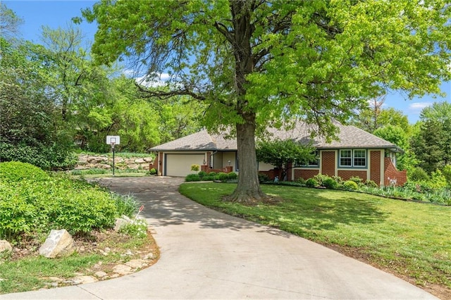 2106 Kasold Dr, Lawrence, KS 66047 - ranch-style house featuring an attached garage, driveway, and a front lawn