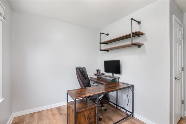 office with light wood finished floors and baseboards