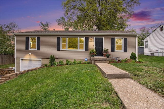 single story home featuring fence, a garage, driveway, and a lawn