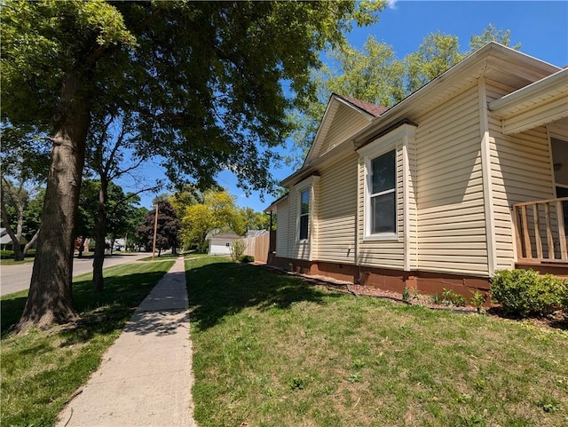 100 E 11th St, Horton, KS 66439 - view of side of home featuring a yard and crawl space