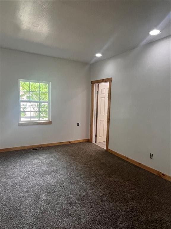 101 S Andrick St, Fort Scott, KS 66701 - carpeted empty room with baseboards and recessed lighting