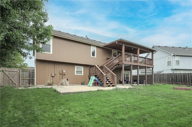 back of property featuring stairs, a patio, and a deck