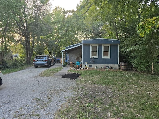 view of side of property featuring driveway