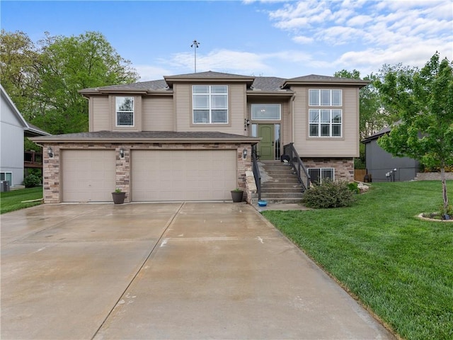 5084 NW Timberline Dr, Riverside, MO 64150 - view of front of house with a garage, driveway, and a front yard