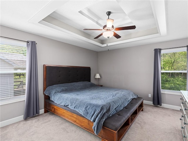 5084 NW Timberline Dr, Riverside, MO 64150 - bedroom featuring baseboards, a tray ceiling, and light carpet