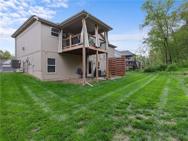 5084 NW Timberline Dr, Riverside, MO 64150 - rear view of property with a lawn, central AC unit, and a balcony