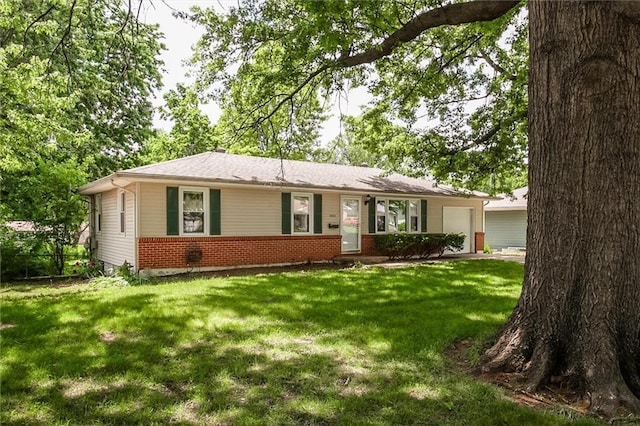 single story home featuring a garage, brick siding, and a front lawn