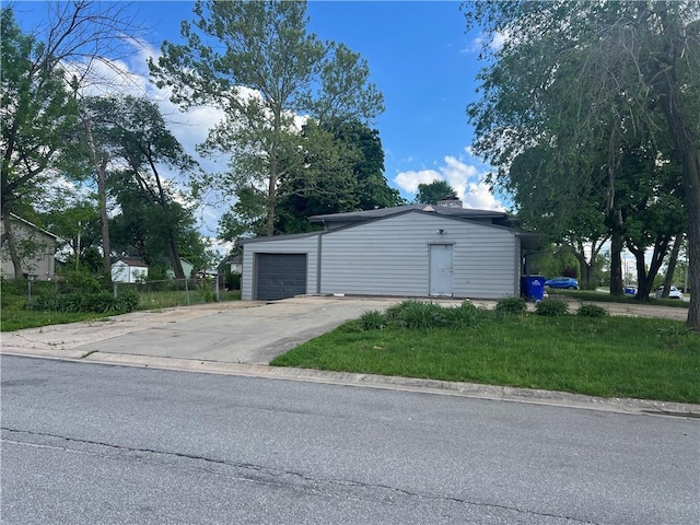 garage featuring driveway