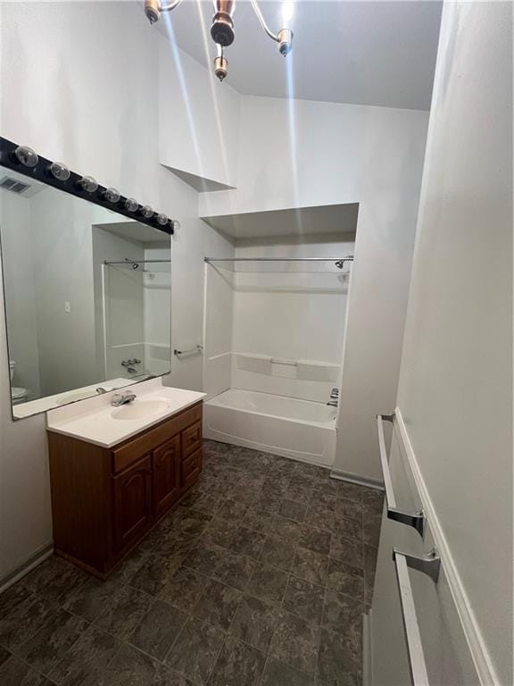 full bath featuring vanity, shower / tub combination, and visible vents