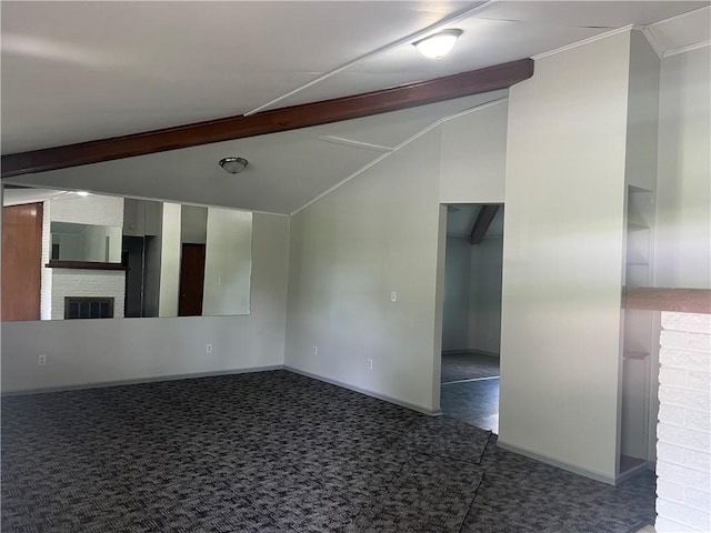 carpeted spare room with crown molding, baseboards, vaulted ceiling with beams, and a brick fireplace