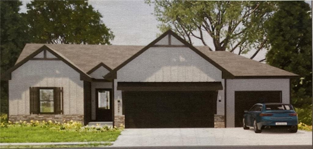 english style home with an attached garage and driveway