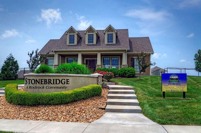 16502 S Stagecoach St, Olathe, KS 66062 - view of front facade with covered porch, roof with shingles, and stucco siding