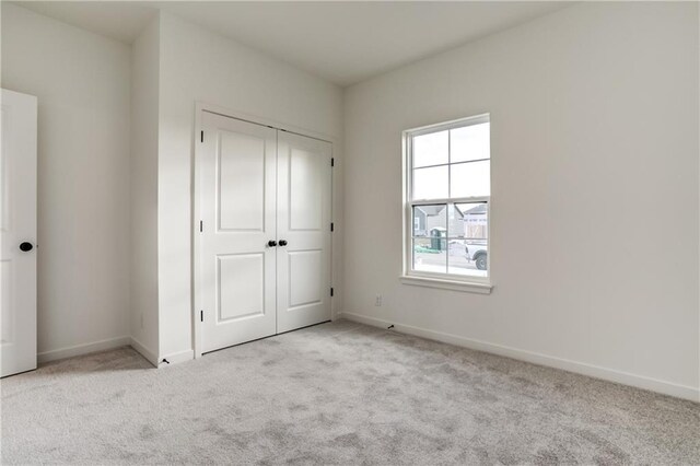 16502 S Stagecoach St, Olathe, KS 66062 - unfurnished bedroom featuring light colored carpet, a closet, and baseboards