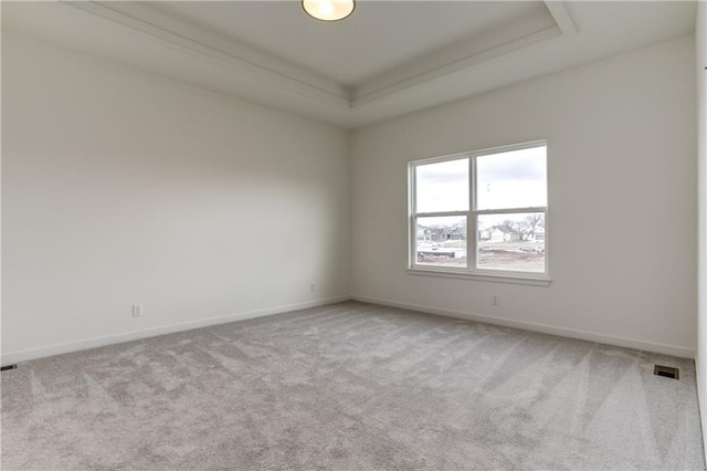 16502 S Stagecoach St, Olathe, KS 66062 - spare room featuring carpet floors, baseboards, and a raised ceiling