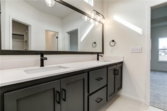 16502 S Stagecoach St, Olathe, KS 66062 - full bath featuring double vanity, baseboards, and tile patterned flooring