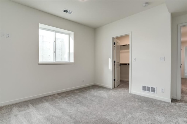 16502 S Stagecoach St, Olathe, KS 66062 - unfurnished bedroom with carpet flooring, baseboards, a walk in closet, and a closet