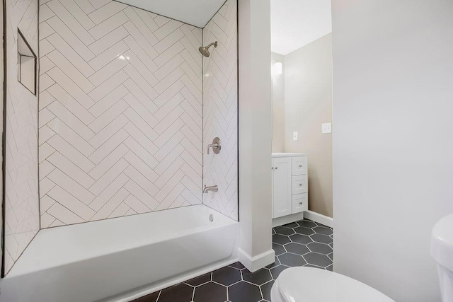 bathroom with shower / tub combination, tile patterned flooring, vanity, toilet, and baseboards