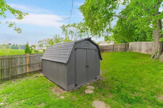 view of shed featuring a fenced backyard