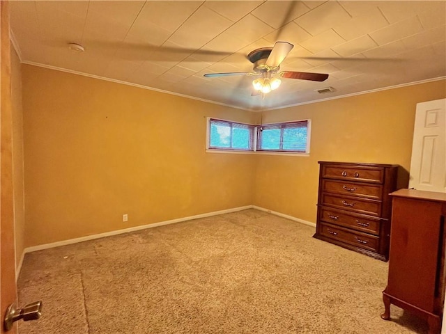 unfurnished bedroom featuring carpet floors, visible vents, and ornamental molding