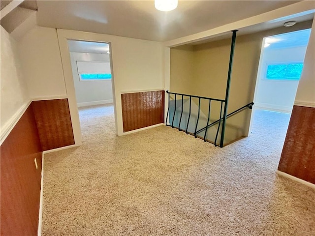 spare room with baseboards and carpet