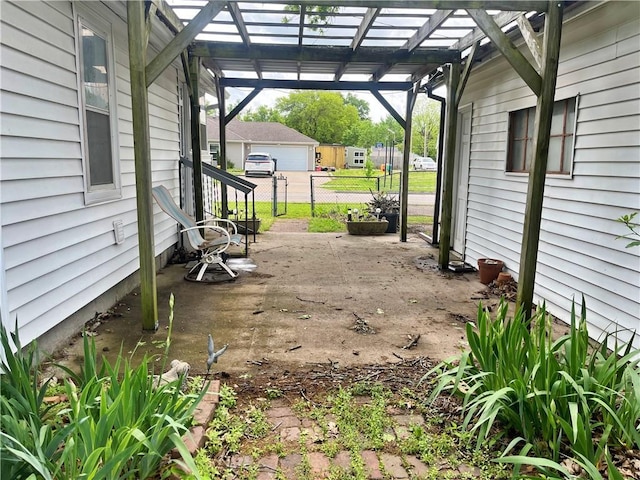 view of patio with fence and a pergola