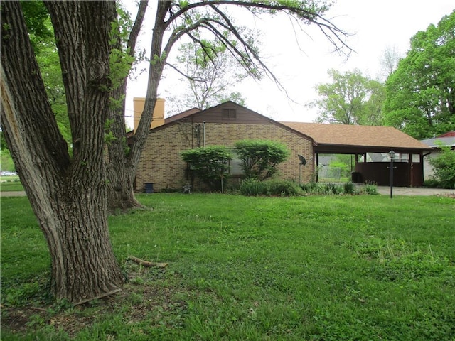 view of property exterior featuring a lawn and brick siding