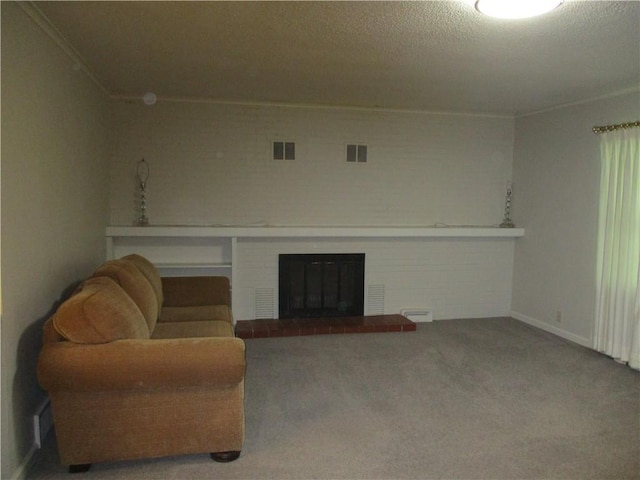 living area featuring carpet floors, visible vents, ornamental molding, and a fireplace