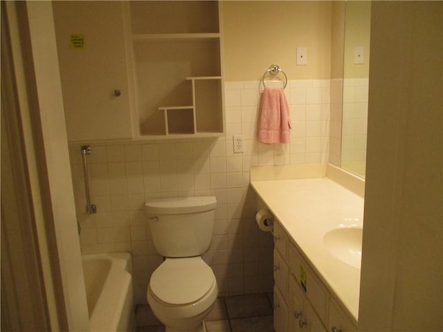 full bath featuring tile walls, a wainscoted wall, vanity, and toilet