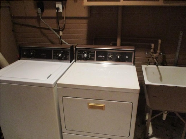 washroom featuring laundry area and washer and clothes dryer