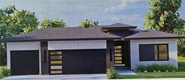 view of front facade featuring an attached garage and driveway