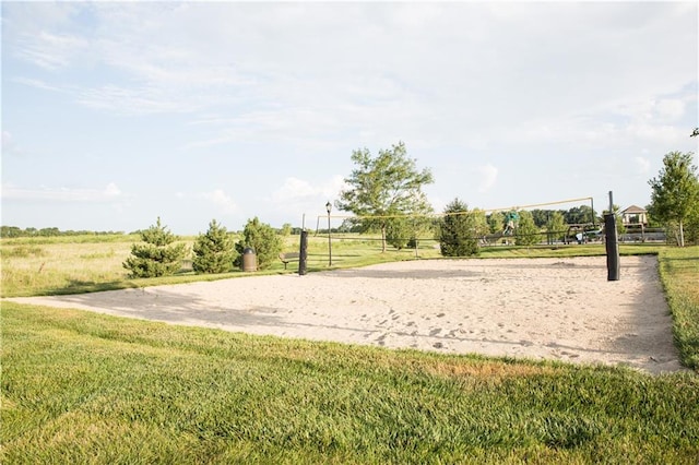 view of home's community with a yard and volleyball court