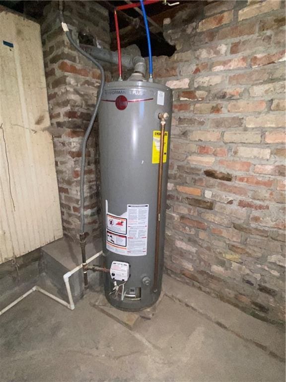 utility room featuring water heater