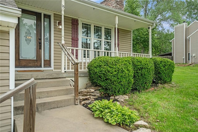 15 Baber Cir, Camden Point, MO 64018 - property entrance with covered porch, a lawn, and a chimney