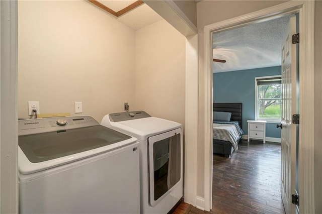 15 Baber Cir, Camden Point, MO 64018 - laundry area featuring independent washer and dryer, dark wood-style floors, a textured ceiling, and baseboards
