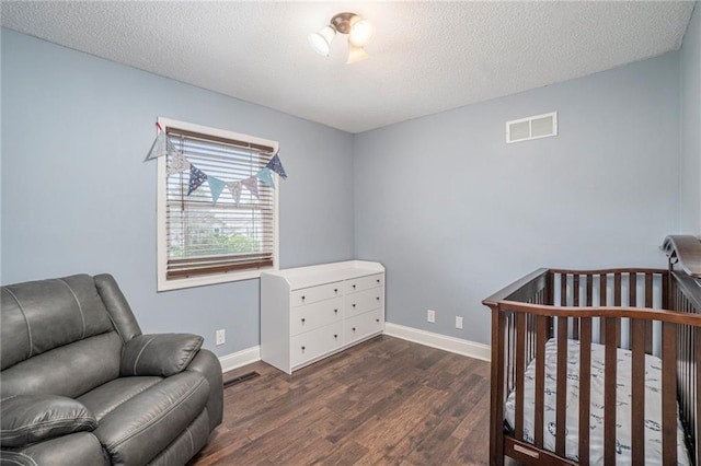15 Baber Cir, Camden Point, MO 64018 - bedroom featuring wood finished floors, baseboards, and a textured ceiling