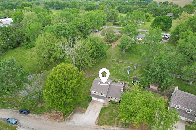 15 Baber Cir, Camden Point, MO 64018 - aerial overview of property's location with a tree filled landscape