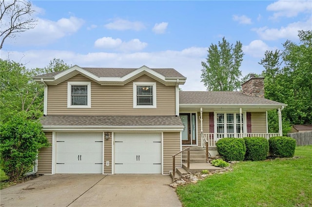 15 Baber Cir, Camden Point, MO 64018 - split level home featuring a garage, covered porch, a front yard, a chimney, and concrete driveway