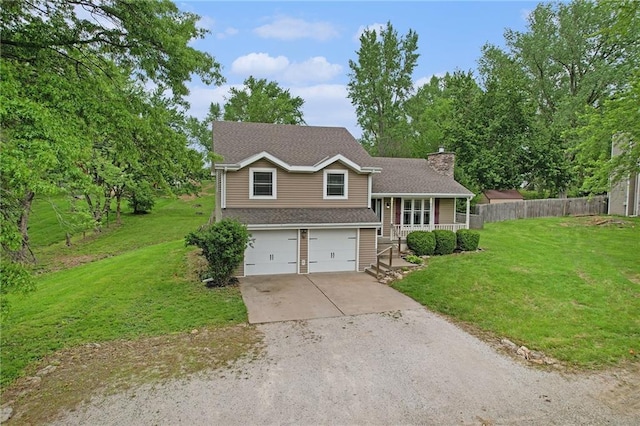 15 Baber Cir, Camden Point, MO 64018 - tri-level home featuring a chimney, driveway, covered porch, an attached garage, and a shingled roof