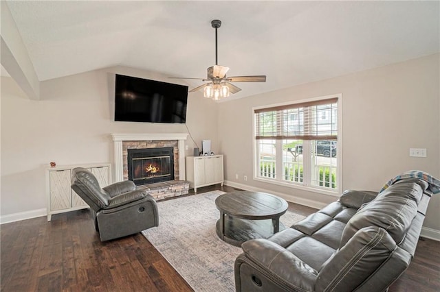 15 Baber Cir, Camden Point, MO 64018 - living room with baseboards, dark wood-style flooring, ceiling fan, lofted ceiling, and a stone fireplace