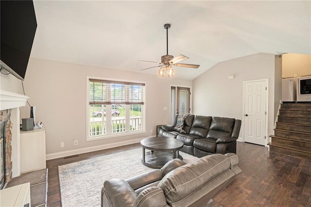 15 Baber Cir, Camden Point, MO 64018 - living area featuring vaulted ceiling, dark wood-style floors, ceiling fan, stairs, and a fireplace