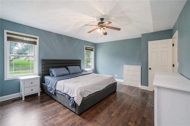 15 Baber Cir, Camden Point, MO 64018 - bedroom featuring baseboards, dark wood-style flooring, ceiling fan, and a textured ceiling