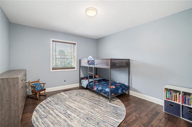 15 Baber Cir, Camden Point, MO 64018 - bedroom with wood finished floors and baseboards