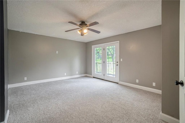 15 Baber Cir, Camden Point, MO 64018 - spare room featuring a ceiling fan, carpet floors, baseboards, and a textured ceiling