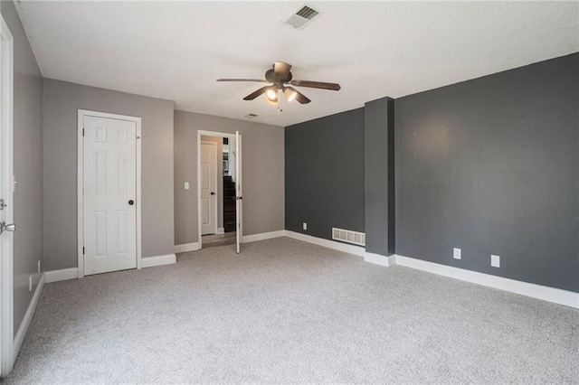 15 Baber Cir, Camden Point, MO 64018 - unfurnished bedroom featuring light colored carpet, baseboards, and ceiling fan