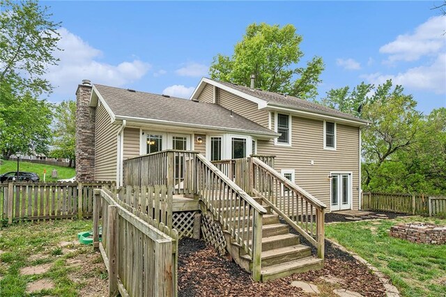 15 Baber Cir, Camden Point, MO 64018 - rear view of house with a chimney, a deck, and stairway