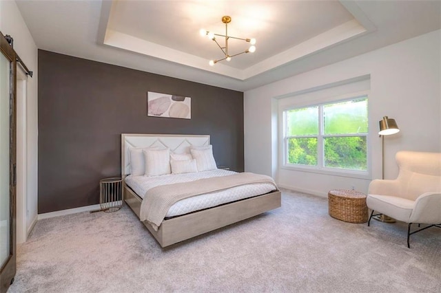 16567 S Stagecoach St, Olathe, KS 66062 - bedroom with a chandelier, light colored carpet, a raised ceiling, and baseboards