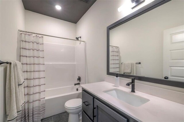16567 S Stagecoach St, Olathe, KS 66062 - bathroom with vanity, shower / tub combo, toilet, and recessed lighting