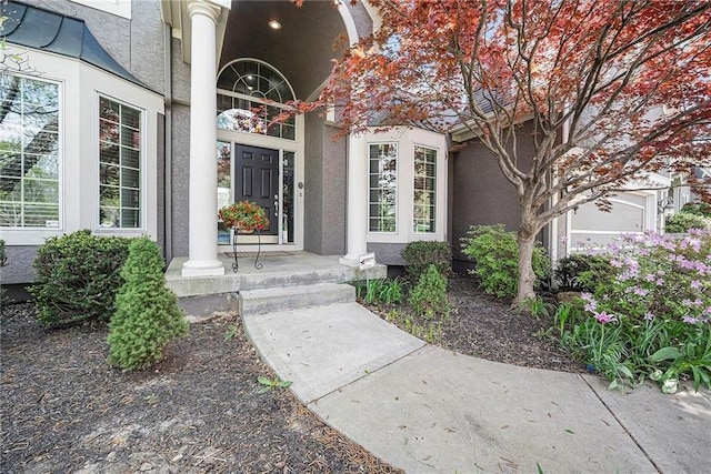 14475 Chadwick St, Leawood, KS 66224 - entrance to property with a porch and stucco siding