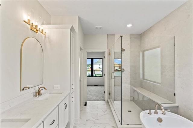 7015 Forest Lks, Parkville, MO 64152 - bathroom featuring marble finish floors, a stall shower, a freestanding bath, double vanity, and recessed lighting